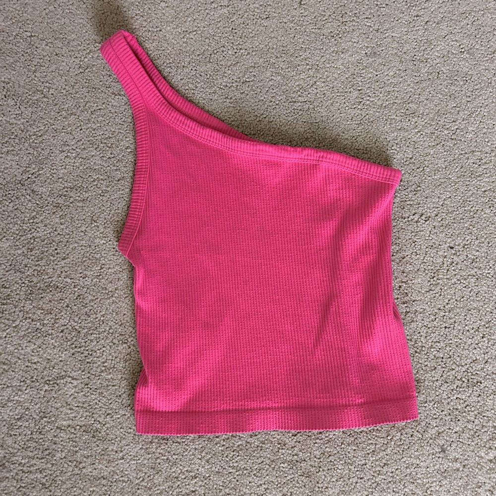Woman’s hot pink, one shoulder tank top. Excellent condition.